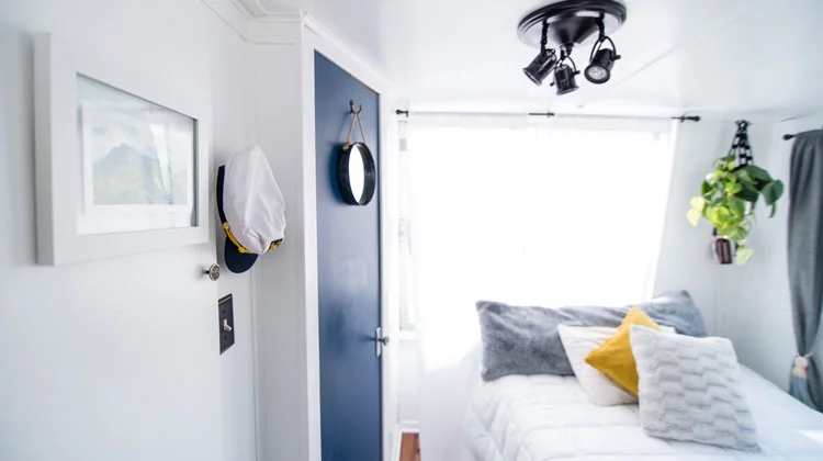 Blue Door and Window With White Curtain Inside Well-Lighted Room