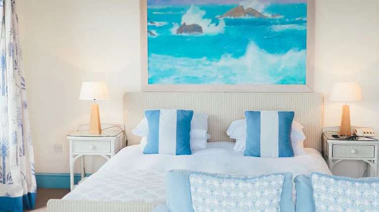 White and Blue Pillows beside Brown Table Lamp White and Blue Pillows beside Brown Table Lamp