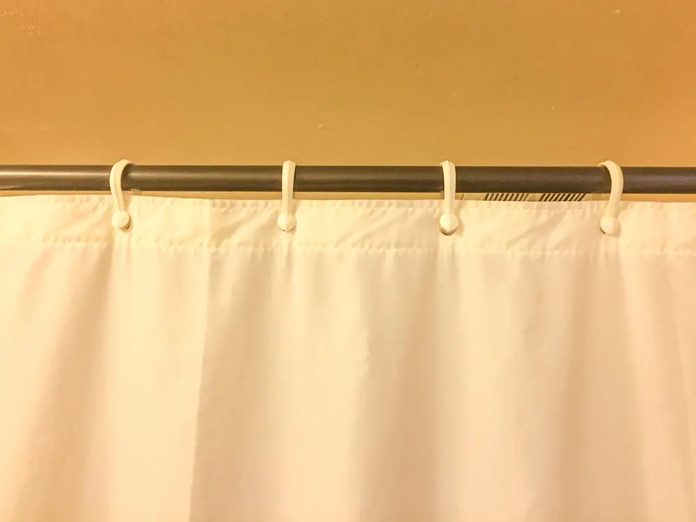 how to remove rust from shower curtain rod image