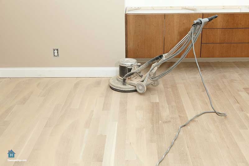 sanding hardwood floors with orbital sander