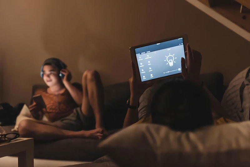 Couple relaxing on couch in their smart home