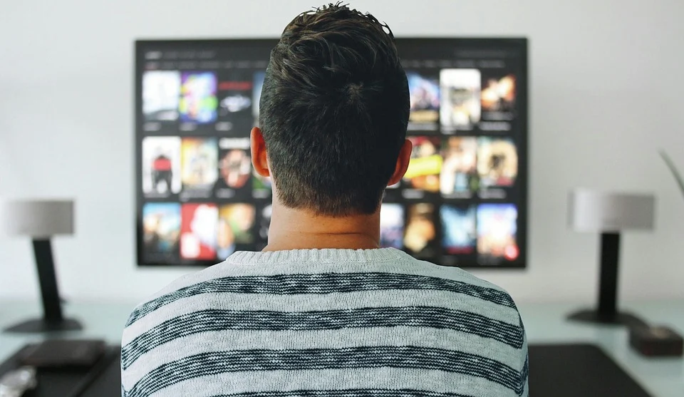 a man enjoying home entertainment with large home theater.weep
