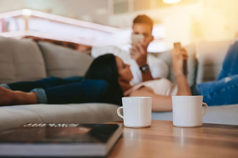 couple-relaxing-on-couch